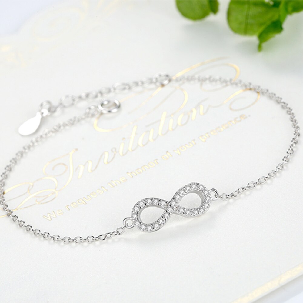 ucky Eye Love Heart Charm Bracelet: Sterling Silver with Blue Clover
