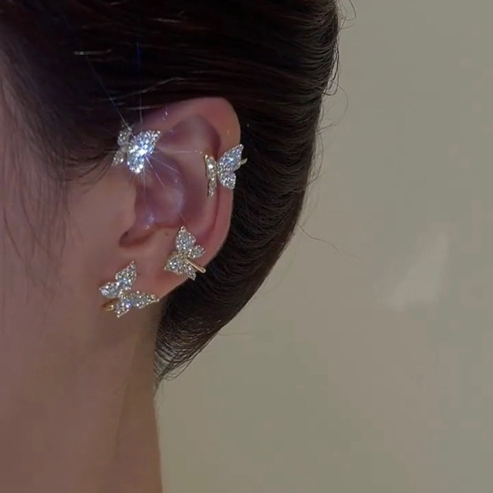 Silver plated metal butterfly earrings with sparkling zircon accents - non-pierced ear cuffs for women as fashionable jewelry