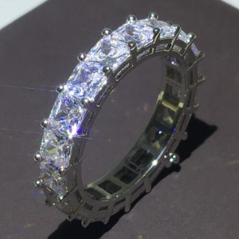 A wedding ring plated with sterling silver 925 and studded with precious zircon stones