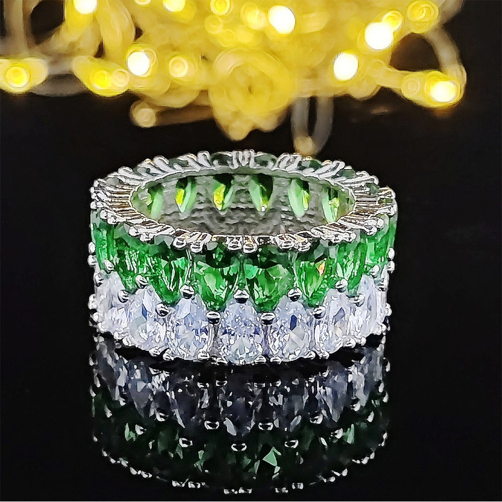 A wedding ring plated with sterling silver 925 and studded with precious zircon stones